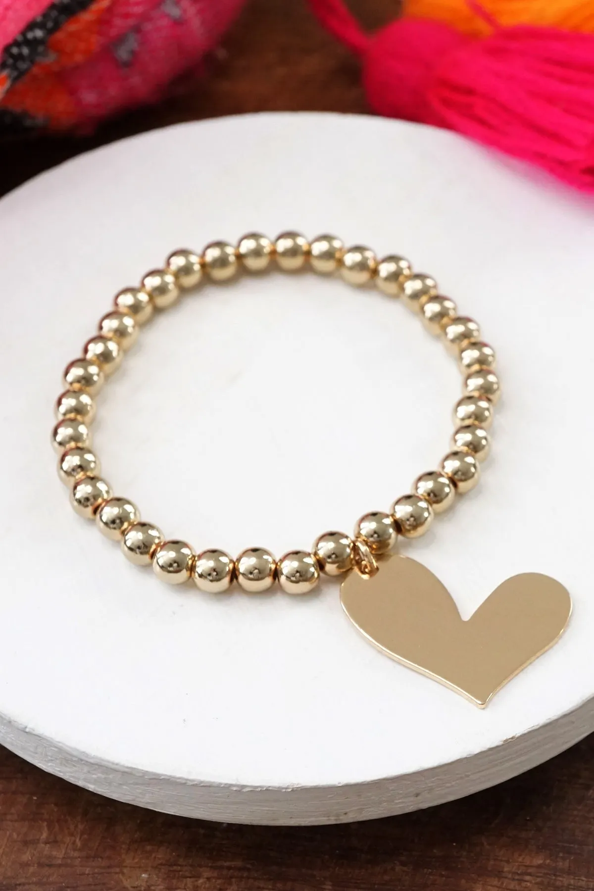 Gold tone beads bracelet with a big Heart charm